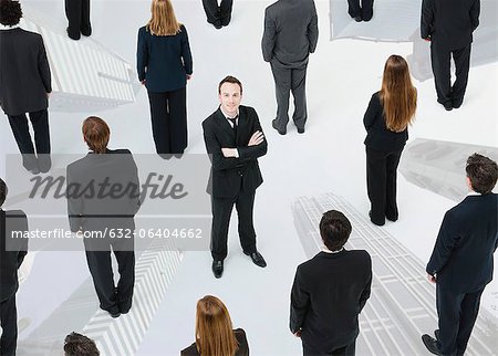 Ambitious businessman standing out from the crowd Ambitious businessman standing out from the crowd