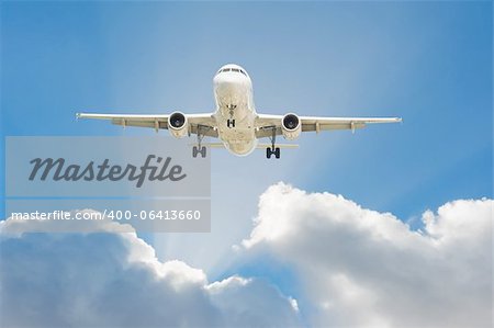 Large passenger airplane flying in the blue sky