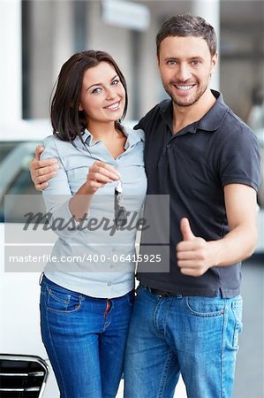Young couple with car keys