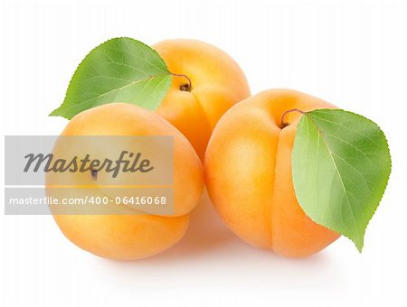 Apricots with leafs isolated on a white background