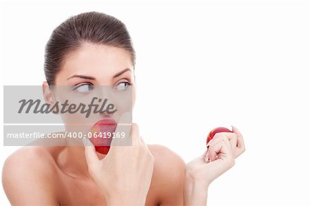 beautiful woman eating peaches and looking to her side over white