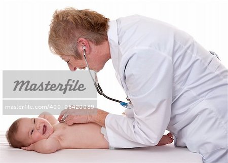 female doctor checking a baby on white isolated background