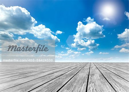 Wood floor and blue sky background