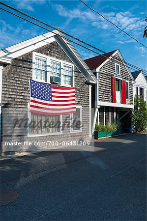 Historic Fisherman's Shingle House Draped with American Flag, Provincetown, Cape Cod, Massachusetts, USA