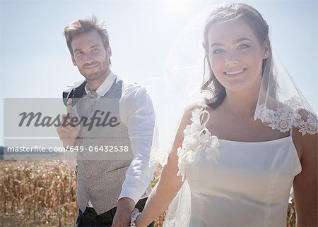 Newlywed couple walking outdoors