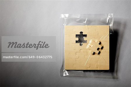 Jigsaw puzzle shrink wrapped in plastic Jigsaw puzzle shrink wrapped in plastic