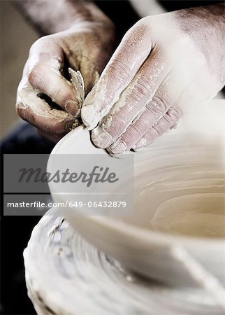 Potter creating handcrafted bowl in shop