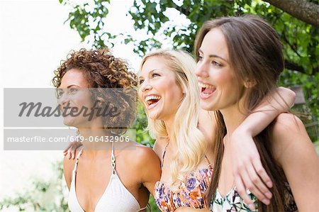 Smiling women standing together