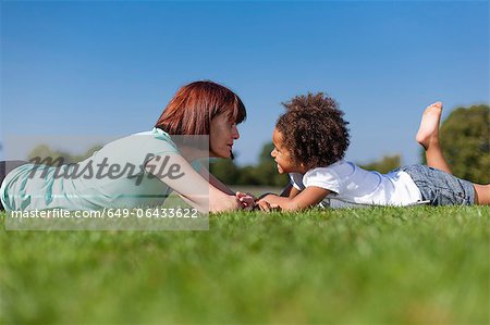 Older woman playing with granddaughter