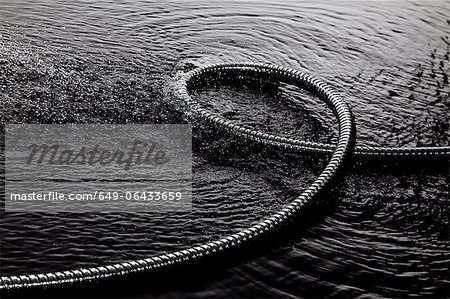 Coiled metal tube in water