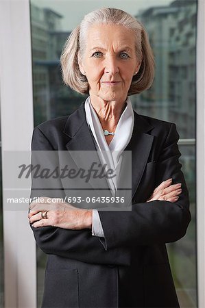 Portrait of confident senior businesswoman with arms crossed