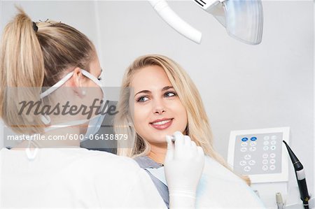 Young Woman at Dentist's Office for Appointment, Germany