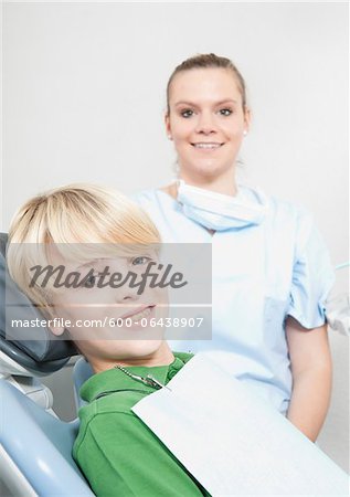 Portrait of Boy and Dental Hygienist in Dentist's Office, Germany