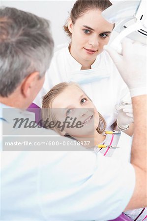 Girl with Dentist and Hygienist at Dentist's Office, Germany