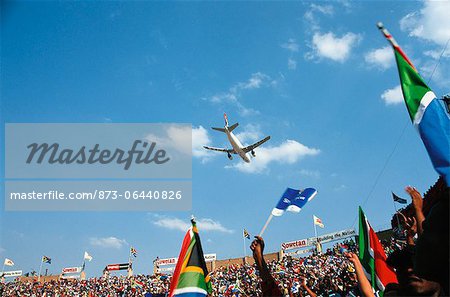 Jumbo Jet Flying Over Stadium