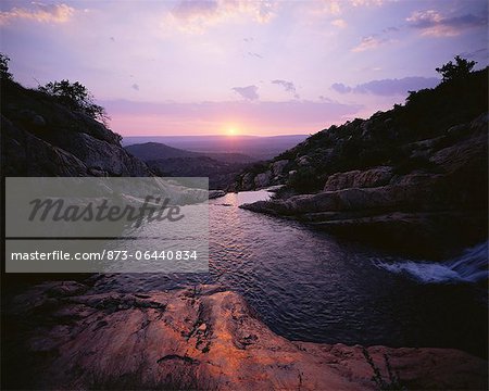 Sunset over Stream and Hills, The Magaliesberg, South Africa Sunset over Stream and Hills, The Magaliesberg, South Africa