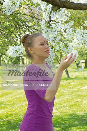 Young woman sneezing