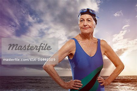 Senior woman wearing swimsuit with hands on hips