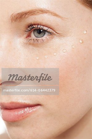 Woman with eye gel on her face