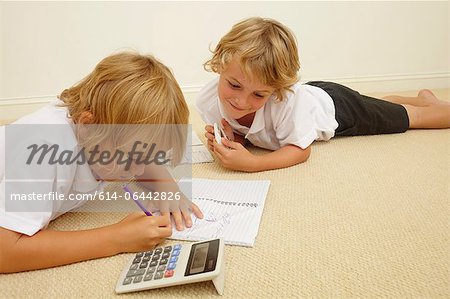 Two schoolboys doing homework