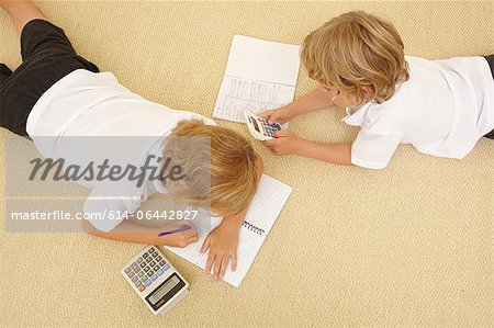Two schoolboys doing homework