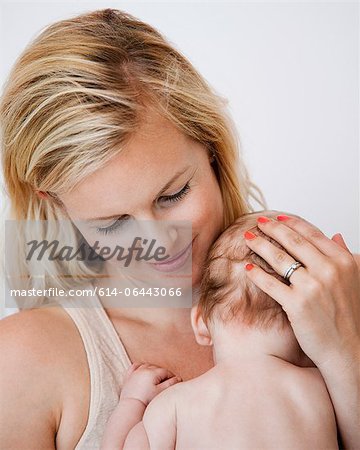 Mother holding newborn baby boy