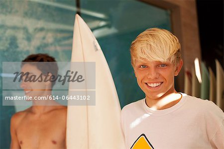 Two young men with surfboard
