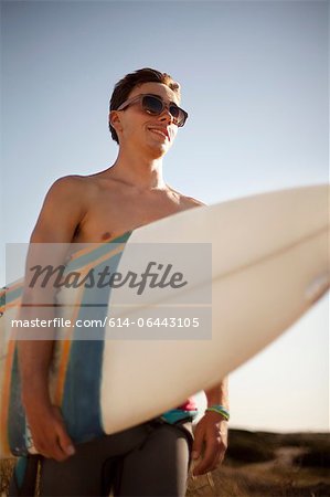 Young man with surfboard