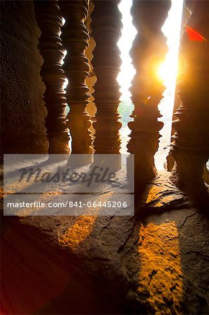 Sunset through stone pillars at Angkor Wat, Angkor Temple Complex, UNESCO World Heritage Site, Siem Reap Province, Cambodia, Indochina, Southeast Asia, Asia