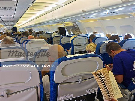 Airbus A320 plane inside cabin with passengers, France, Europe