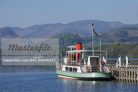 A tourist lake steamer awaits passengers at Pooley Bridge pier, Lake Ullswater, Lake District National Park, Cumbria, England, United Kingdom, Europe
