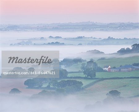 Farmhouse and mist covered countryside, Stockleigh Pomeroy, Devon, England, United Kingdom, Europe