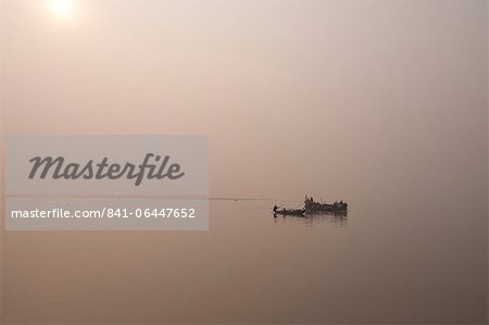 Fishing boats and ferry on the River Ganges in the early morning, Sonepur, Bihar, India, Asia