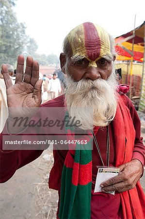 Vaishnavite pundit dressed in red and with heavy sandalwood and abir tilak on his forehead, at Sonepur Cattle Fair, Bihar, India, Asia