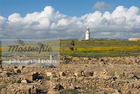 View over ruined Roman town to the lighthouse, The Agora, Archaeological Park, Paphos, UNESCO World Heritage Site, Cyprus, Europe