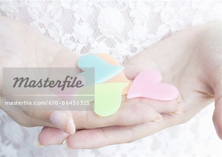 Hand holding hearts Hand holding hearts