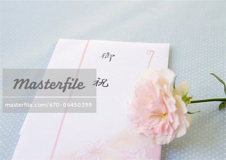 Congratulatory gift envelope and a rose Congratulatory gift envelope and a rose