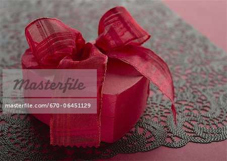 Gift box tied with red ribbon Gift box tied with red ribbon