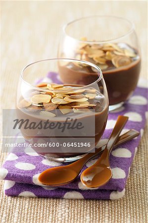 Close-up of Glasses of Chocolate Pudding with Slivered Toasted Nuts