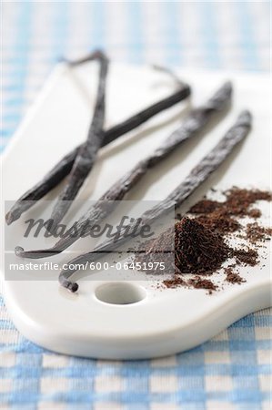 Close-up of Vanilla Beans and Ground Vanilla on Cutting Board