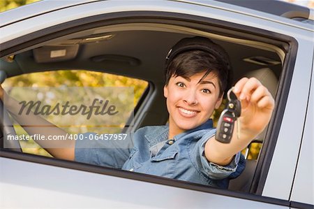 Happy Smiling Mixed Race Woman in Car Holding Set of Keys.