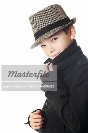 Young boy wearing a hat over white background