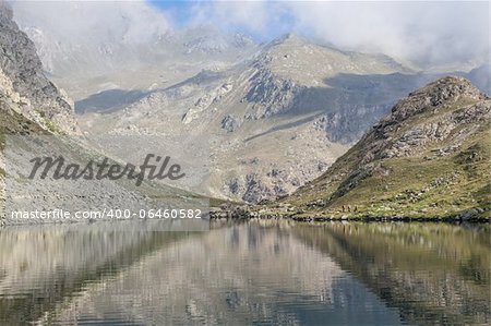 Alpine lake close to the path to the top of Monviso mountain, one of the most scenic mountain of Alps