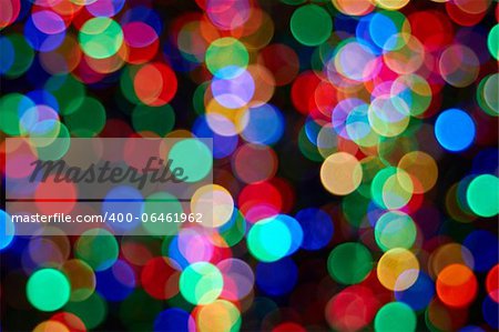 Christmas Tree with Colorful Out of Focus Blurred Light on Black Background Closeup