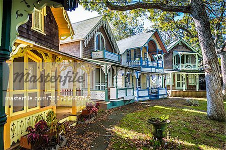 Row of Colorful Cottages in Wesleyan Grove, Camp Meeting Association Historical Area, Oak Bluffs, Martha's Vineyard, Massachusetts, USA Row of Colorful Cottages in Wesleyan Grove, Camp Meeting Association Historical Area, Oak Bluffs, Martha's Vineyard, Massachusetts, USA