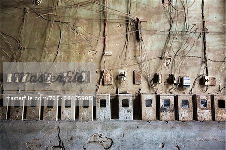 Row of Electrical Wiring and Meter Boxes in Residential Building, Havana, Cuba Row of Electrical Wiring and Meter Boxes in Residential Building, Havana, Cuba