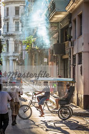 Cycle Rickshaw with Passengers on Busy City Street, Havana, Cuba