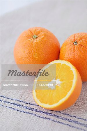 Oranges on a luncheon mat