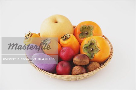 Mixed Autumn fruits in a wooden basket