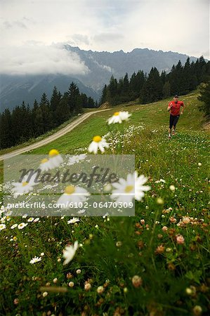 A man jogging in the mountains, Italy.